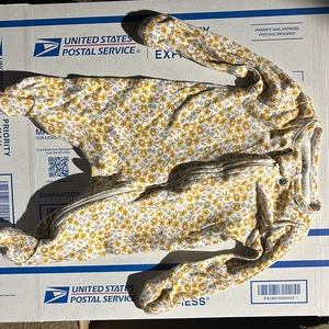 Bundle of newborn onesies, 2 beanies and 1 pair of pants